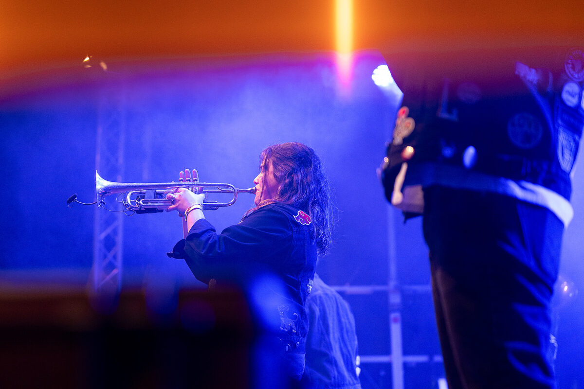 Female trumpeter of Hunneg-Strëpp live on stage, event photography for organisers by Am Fokus Luxembourg